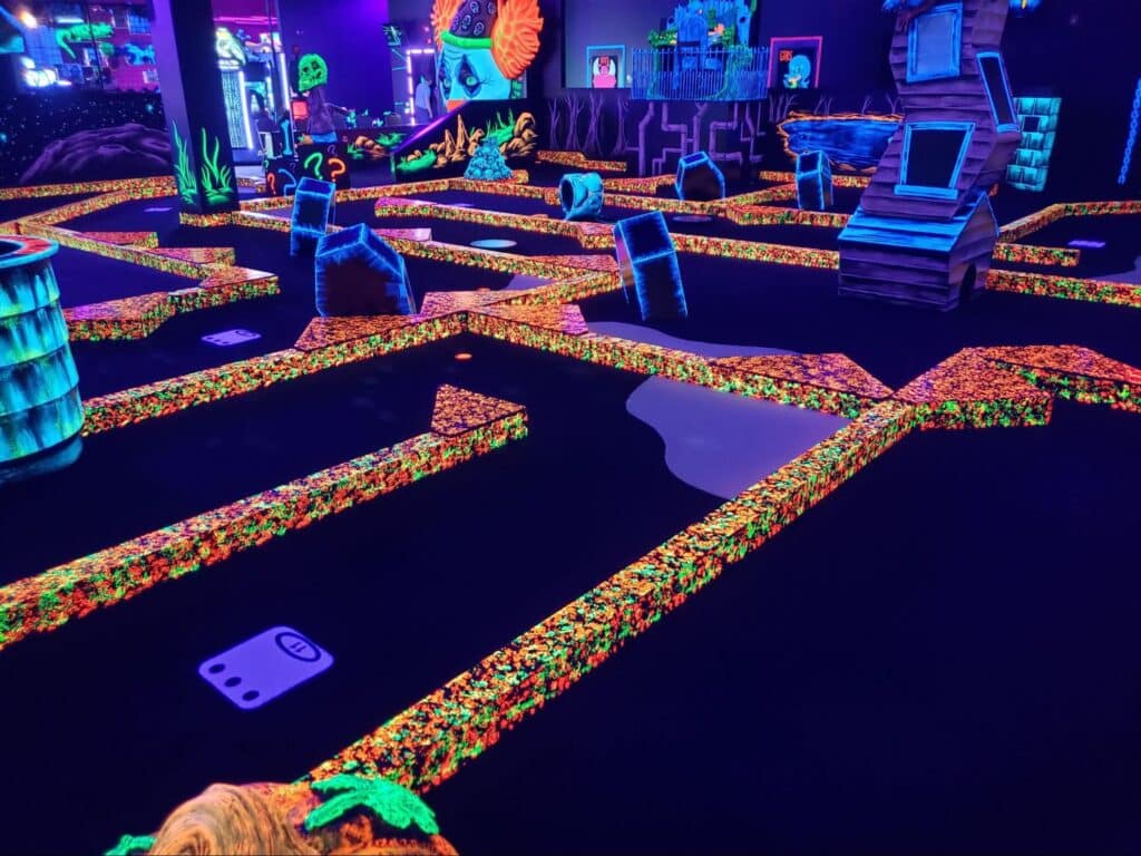 Group Events 3 A glow-in-the-dark indoor golf course at monster mini golf.