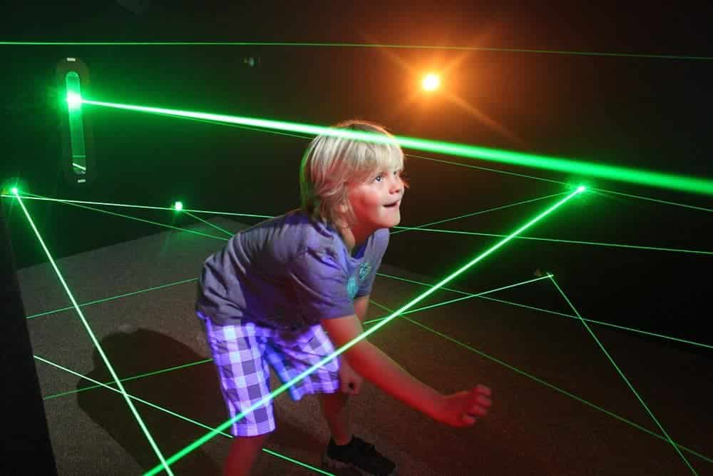 Kid playing in a laser maze at gaithersburg field trip