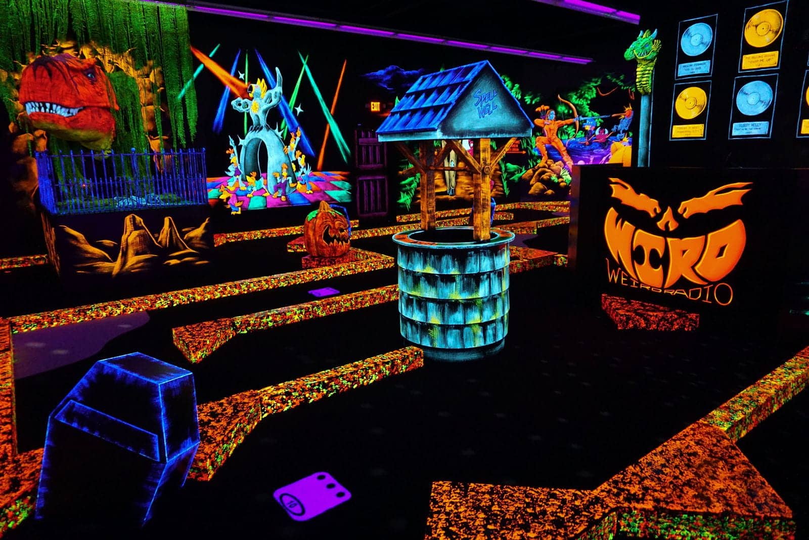 Date Night Activities In Seekonk, Ma 1 A neon glow-in-the-dark indoor mini golf course at a monster mini golf location.