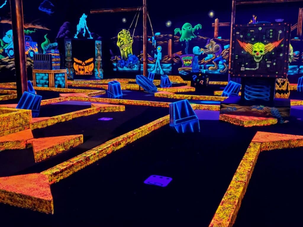 Fundraising At Monster Mini Golf In Bellevue 4 A neon indoor mini golf course at a monster mini golf location.