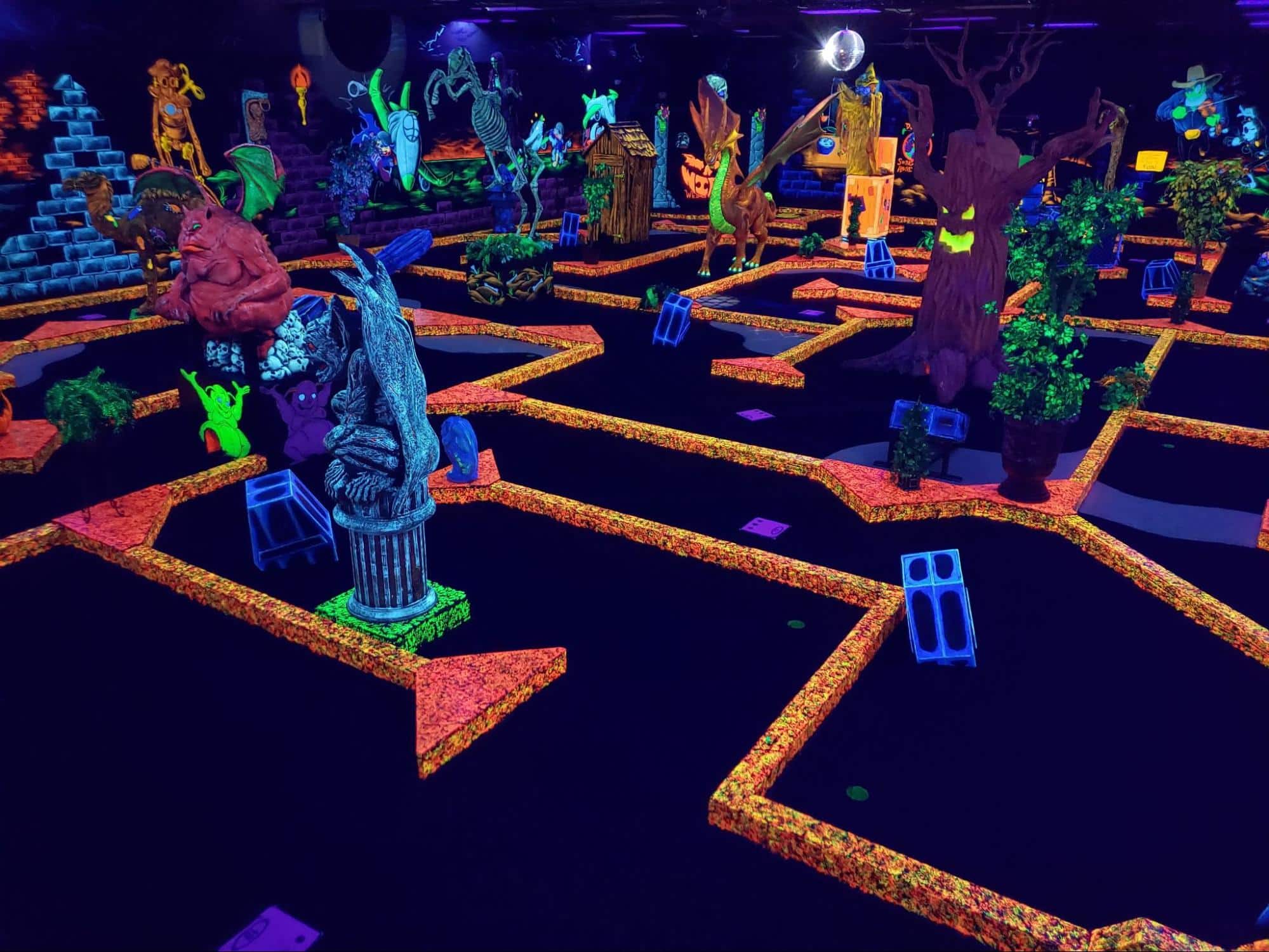 The Best Kids’ Birthday Party Places In Monmouth County 1 Neon monster decorations at a monster mini golf location.